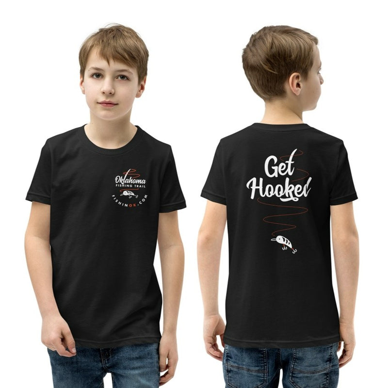 Oklahoma Fishing Trail Double Sided Youth Boys T-Shirt in Black. Oklahoma Fishing Trail left chest print on the front, and "Get Hooked" fish design on the back.