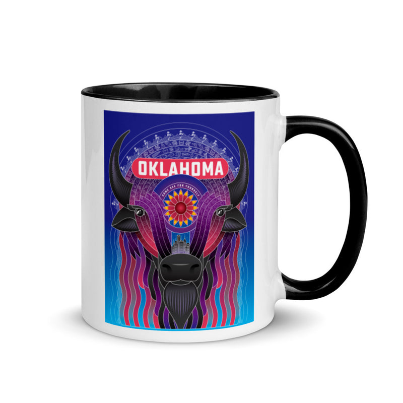 Ceramic mug with black handle and a vibrant illustrated bison decorated with an Indian Blanket wildflower and downtown Oklahoma City. Line one text reads "Oklahoma." Line two text reads "Come See For Yourself." Right view.